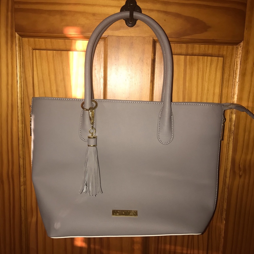 New Joy Iman leather purse.